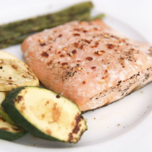 A serving of our wild-caught keta salmon with some veggies on the side
