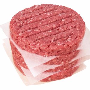 Four stacks of 4/4oz Thin Beef Patties on top each other on a white background