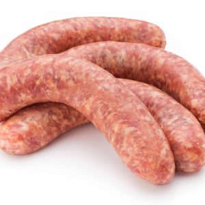 Four pieces of Pork Country Sausage Grillers stacked together on white background